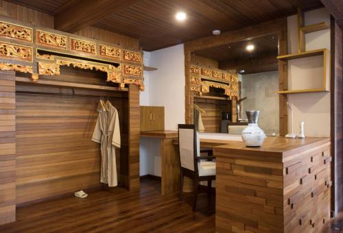 a room with a table and a dining room at Green Field Resort Ubud in Ubud