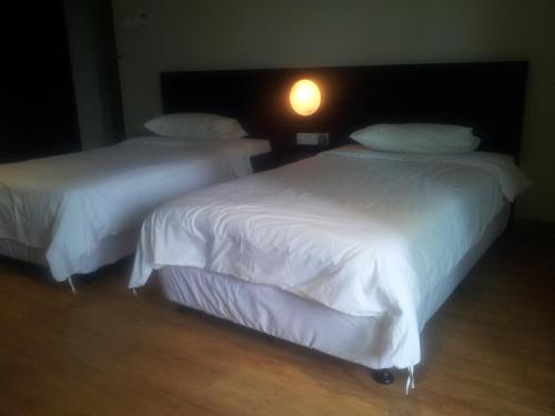 Cama o camas de una habitación en Tanjung Villa