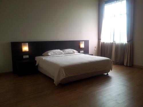 Cama o camas de una habitación en Tanjung Villa