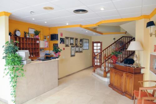 a lobby of a store with a counter and a staircase at Plaça Vella in Sant Carles de la Ràpita