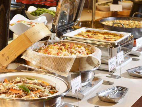 a display of different types of food in trays at jyozankei Shikanoyu in Jozankei