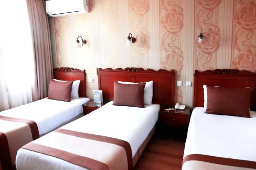 מיטה או מיטות בחדר ב-Yusufpasa Konagi - Special Class