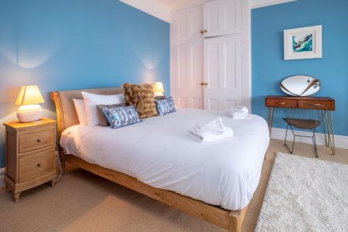 Ein Bett oder Betten in einem Zimmer der Unterkunft Stoney Beach - Aldeburgh Coastal Cottages