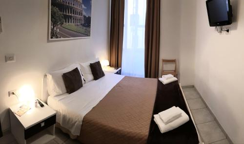 Cama o camas de una habitación en Cialdini Rome