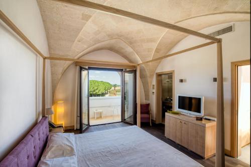 Postel nebo postele na pokoji v ubytování Masseria Bagnara Resort & Spa