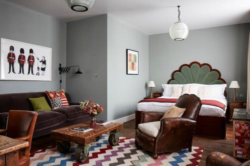 a living room filled with furniture and a couch at Artist Residence London in London
