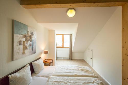 En eller flere senger på et rom på Apart Holidays - Marina Walensee