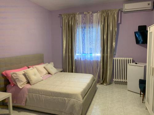 Postel nebo postele na pokoji v ubytování Albergo Lamanna Hotel digitale