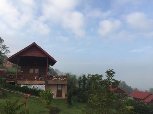 a house on the side of a hill at The Memory of Khaokho in Phetchabun