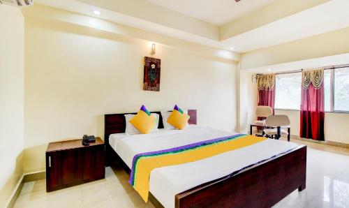 a bedroom with a large bed in a room at Itsy Hotels Aditya in Nagpur