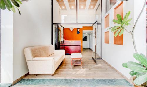a living room with a couch and a table at Itsy Hotels Aditya in Nagpur