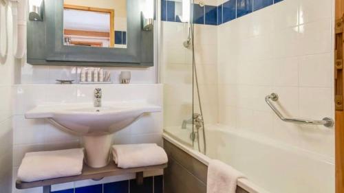 a bathroom with a sink and a bath tub and a sink at Arc 1950 Apartment - Sources de Marie, Mountain View in Arc 1950