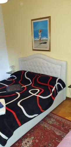 a bedroom with a bed with a design on it at Civico 22 Pisa in Pisa