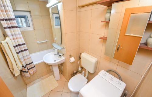 a small bathroom with a toilet and a sink at Victoriei_Majestic in Bucharest