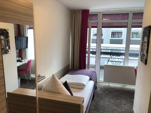 Hotel Mirabell by Maier Privathotelsにあるベッド