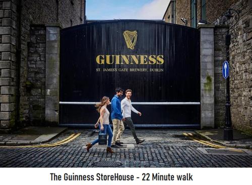a group of people walking in front of a container at Henrietta Suites City Centre in Dublin