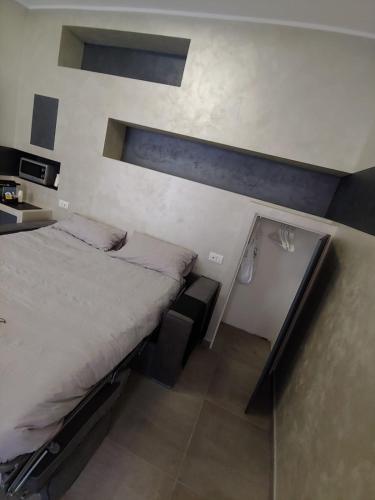 a bedroom with a large bed in a room at NF8 Torino in Turin
