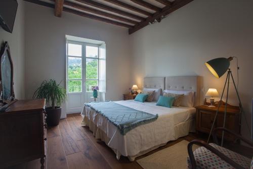 Un pat sau paturi într-o cameră la Posada Seis Leguas