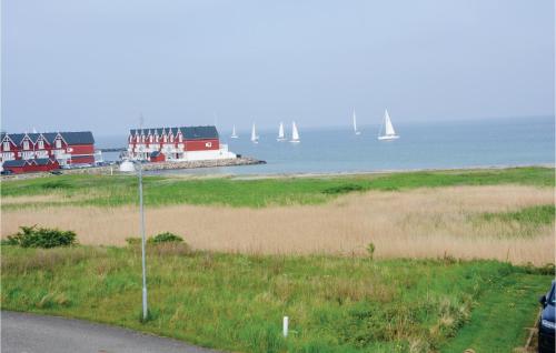a view of a beach with sailboats in the water at Holiday Home Strandgårdsvej Bagenkop Denm in Bagenkop