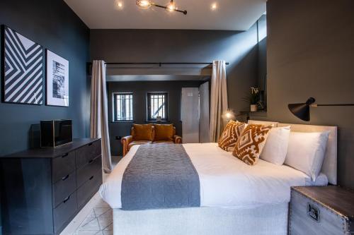 a bedroom with a large bed and a television at Nirvana in Southend-on-Sea