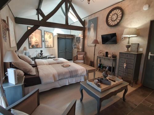 Ein Bett oder Betten in einem Zimmer der Unterkunft Chambres d'hôtes Nuits Campagnardes