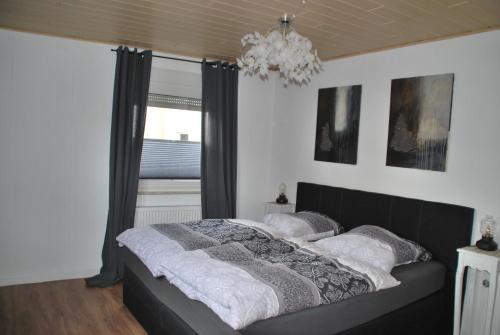 En eller flere senger på et rom på Ferienhaus Moselblick