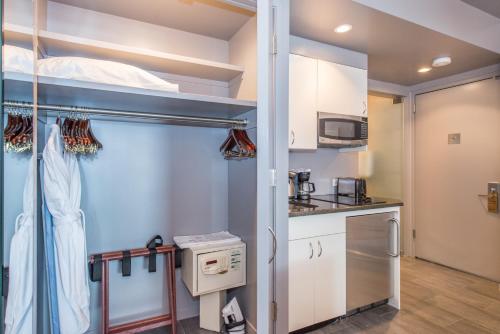 a room with a bunk bed and a kitchen at Lombardy Hotel in New York