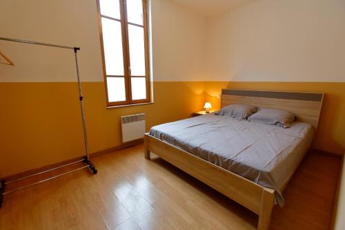 Postel nebo postele na pokoji v ubytování Appart'Hôtel de la Tour