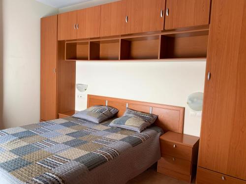 a bedroom with a bed with two pillows on it at Apartamentos Canillo Ribagrossa 3000 in Canillo