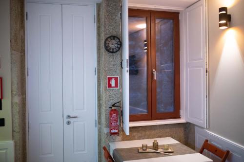 a bathroom with a sink and a mirror at Oporto Ana's Studio in Porto