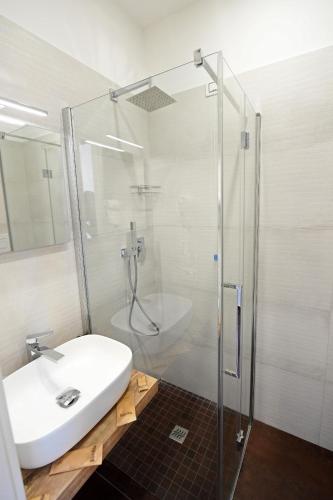 a bathroom with a white sink and a shower at B&B IN CENTRO STORICO SALERNO in Salerno