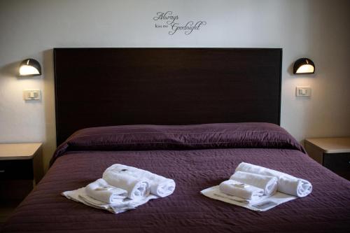 Hotel Vela D'Oroにあるベッド