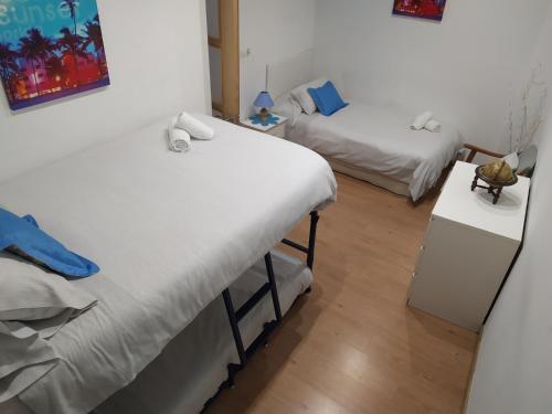 A bed or beds in a room at Apartamento Gabierrota