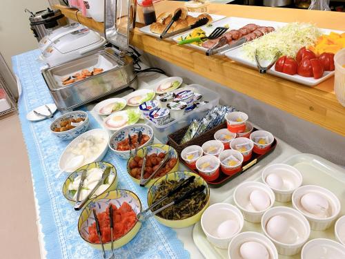 a buffet with many different types of food on a table at Dream Village Kitakami in Kitakami
