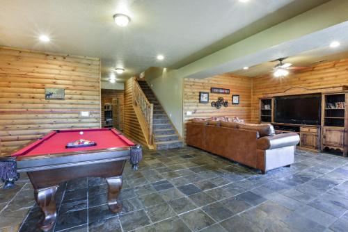 a billiard room with a pool table and a couch at Luxury Lakefront Chalet Resort 2 Pools FREE Amenities Dock Kayaks Waterslide in Lampe