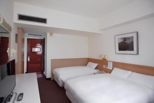天津大飯店 房間的床
