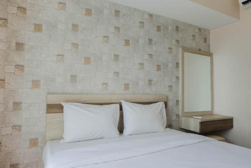 Postel nebo postele na pokoji v ubytování Comfy 1BR Apartment Casa De Parco Central BSD City By Travelio