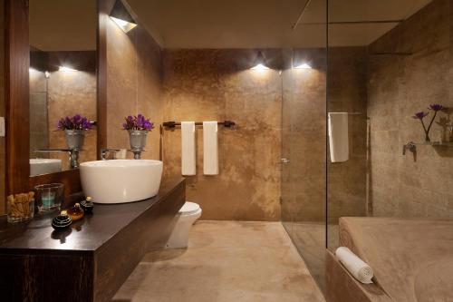 a bathroom with a sink and a toilet and a shower at Green Casa in Galle