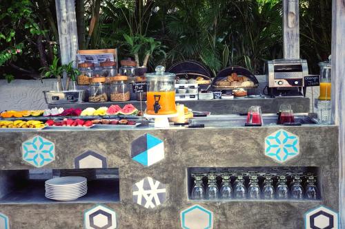 a buffet of food and drinks on a table at Sailing Club Resort Mui Ne in Mui Ne