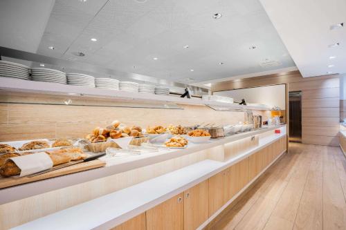 a buffet line with a lot of food on display at Hey Lou Hotel Friedrichshafen in Friedrichshafen