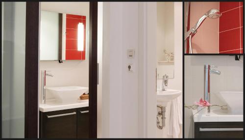 a bathroom with two sinks and a mirror at Miró Studio Apartments Dubrovnik in Dubrovnik