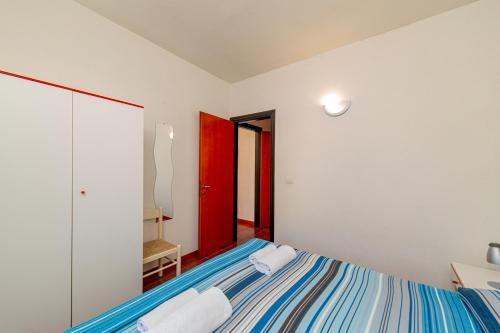 Giường trong phòng chung tại Residence Arcobaleno