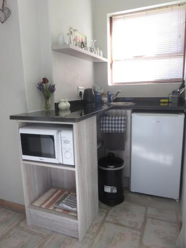 Η κουζίνα ή μικρή κουζίνα στο Cul de Sac - Accommodation