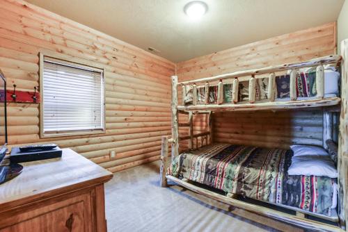 a bedroom with a bunk bed in a log cabin at Luxury Lakefront Chalet Resort 2 Pools FREE Amenities Dock Kayaks Waterslide in Lampe