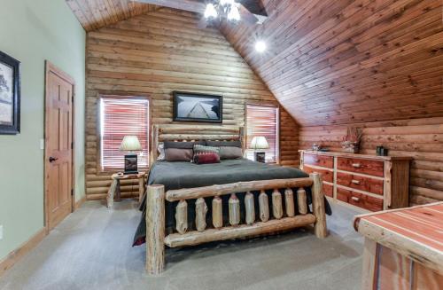 a bedroom with a bed in a log cabin at Luxury Lakefront Chalet Resort 2 Pools FREE Amenities Dock MiniGolf Waterslide in Lampe