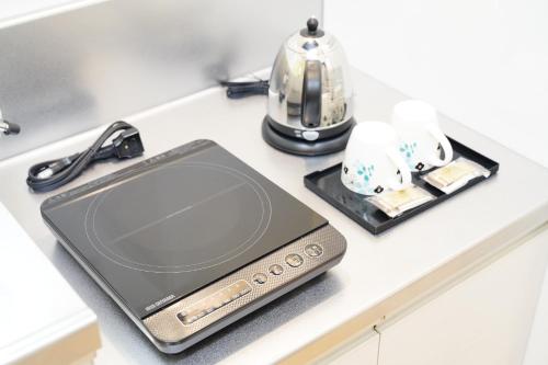 Utensilios para hacer té y café en Condominium GOLF GOLF Tsuboya
