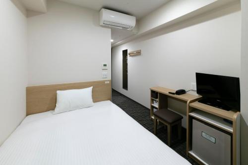 Postel nebo postele na pokoji v ubytování R&B Hotel Kyoto Shijo Kawaramachi