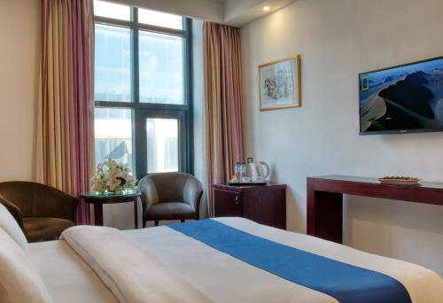 En eller flere senger på et rom på Torino Hotel Amman