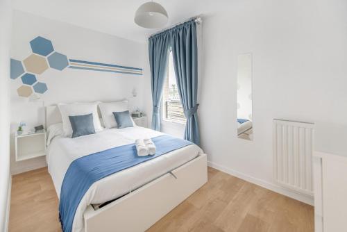 Postel nebo postele na pokoji v ubytování Appartement de 4 chambres à 13 minutes de Paris (train)
