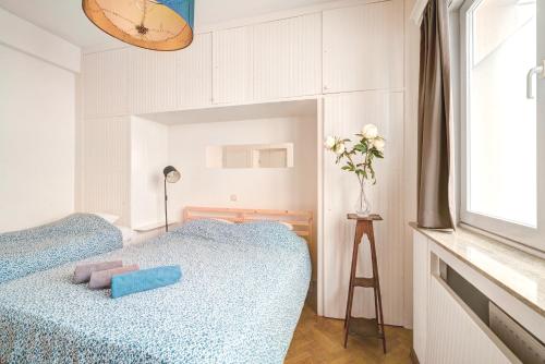 a bedroom with two beds and a window at Cozy Apartment on Best Location in Antwerp in Antwerp